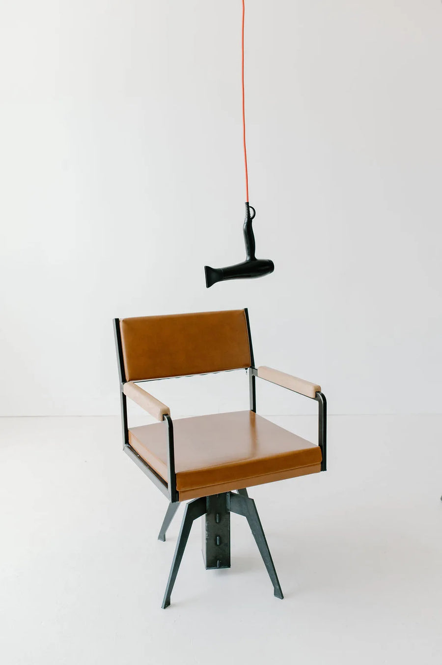 Moda Salon blow dryer hanging over a salon chair