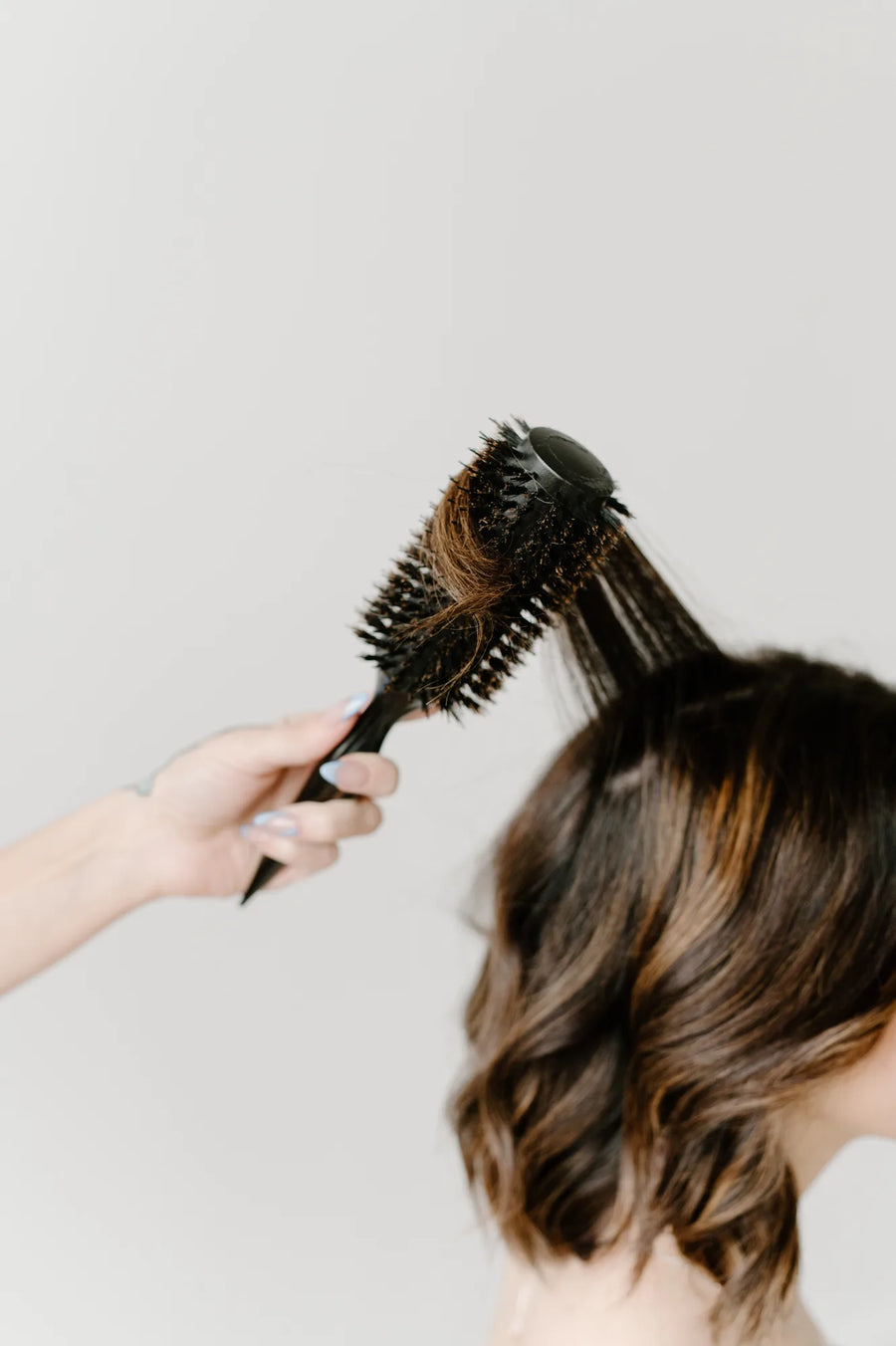 Moda Salon round-brush brunette blowout