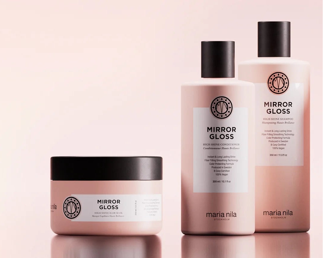 Set of skincare products on a pink background
