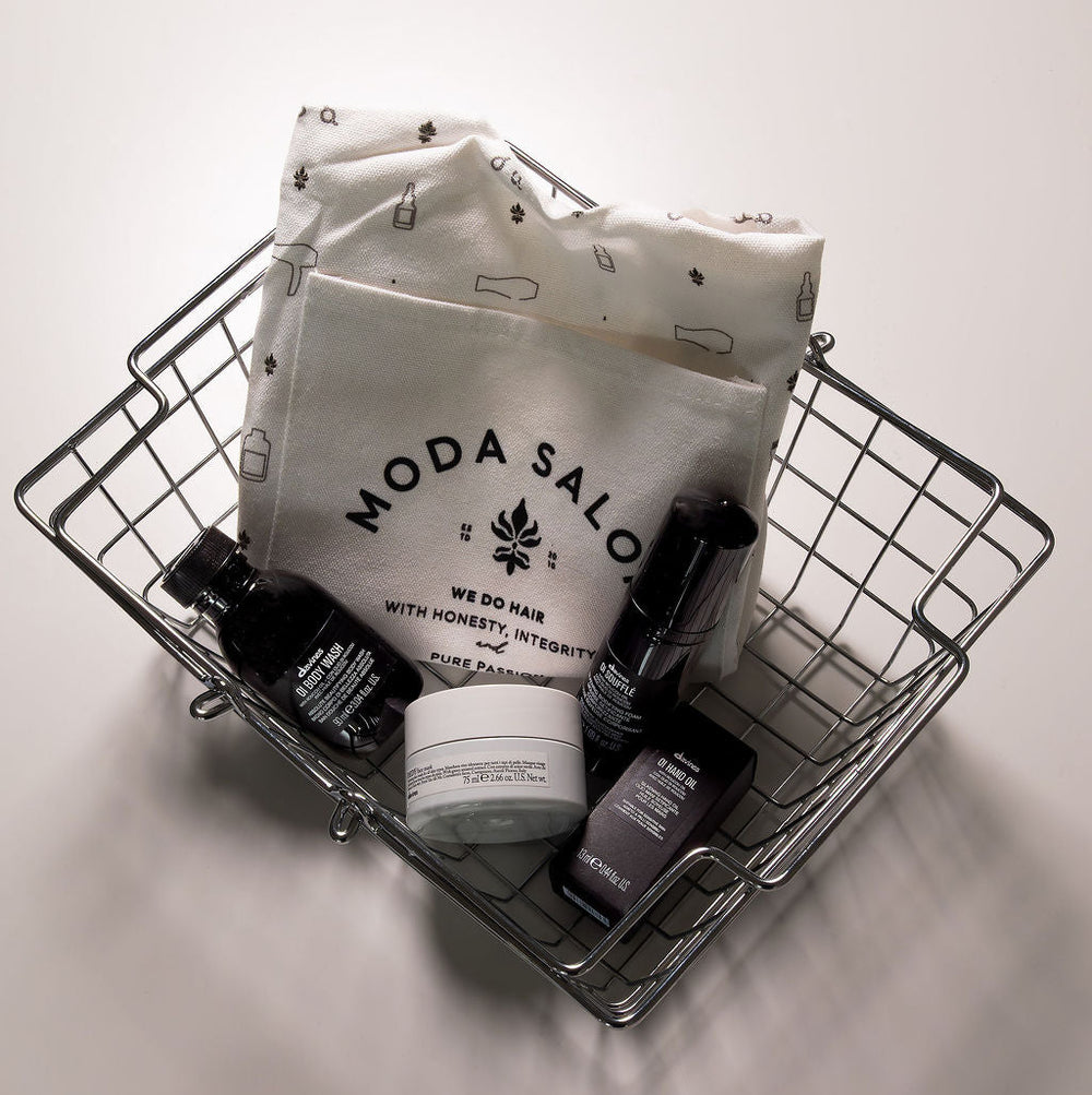 Basket with Moda Saloon products on a light background