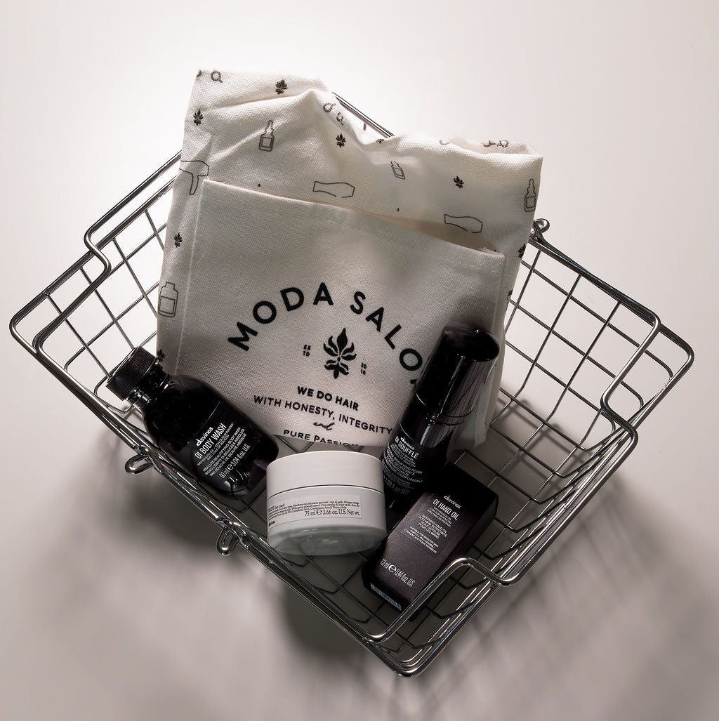 Basket with Moda Saloon products on a light background