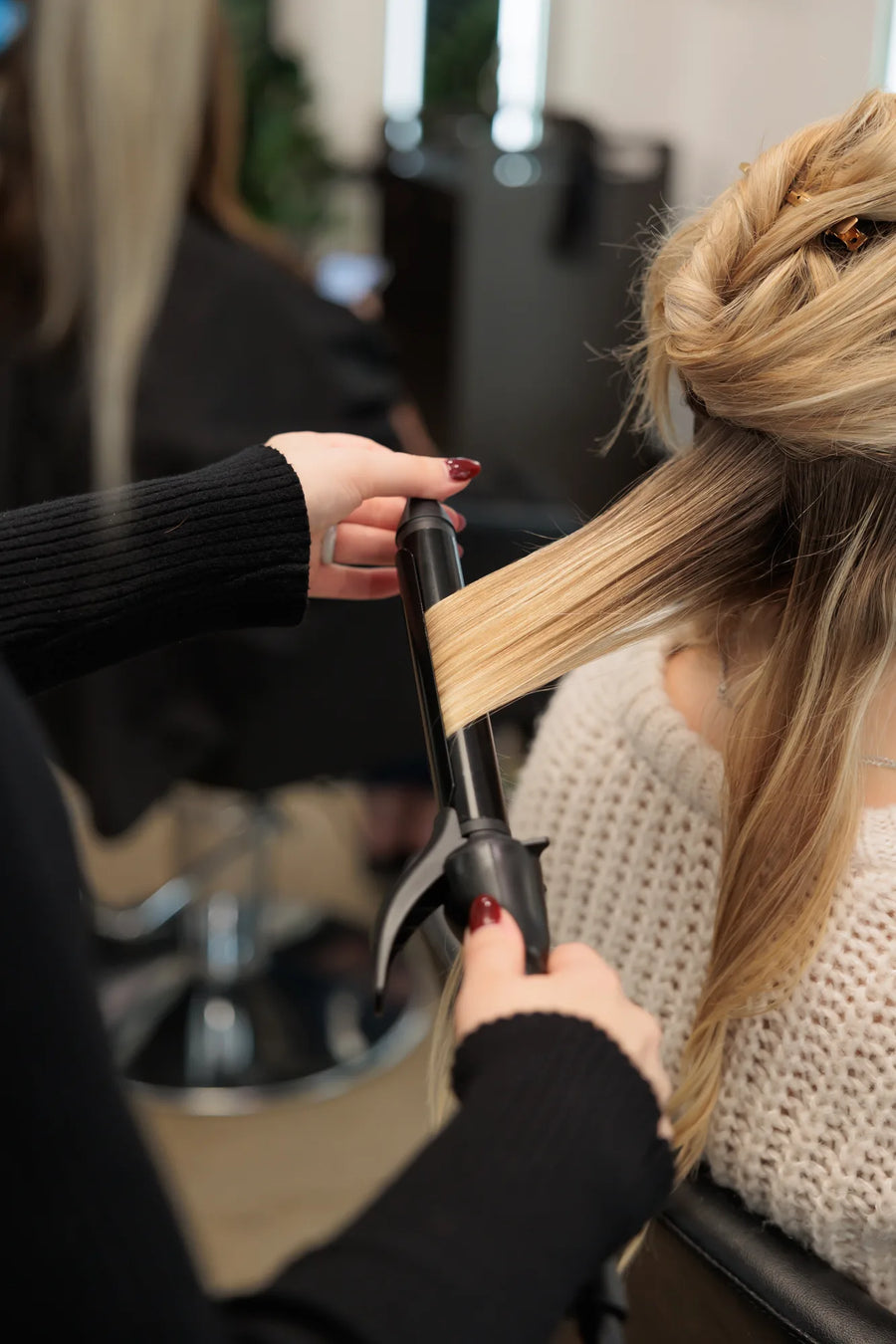 Moda Salon Bowmanville stylist curling blonde hair, detail