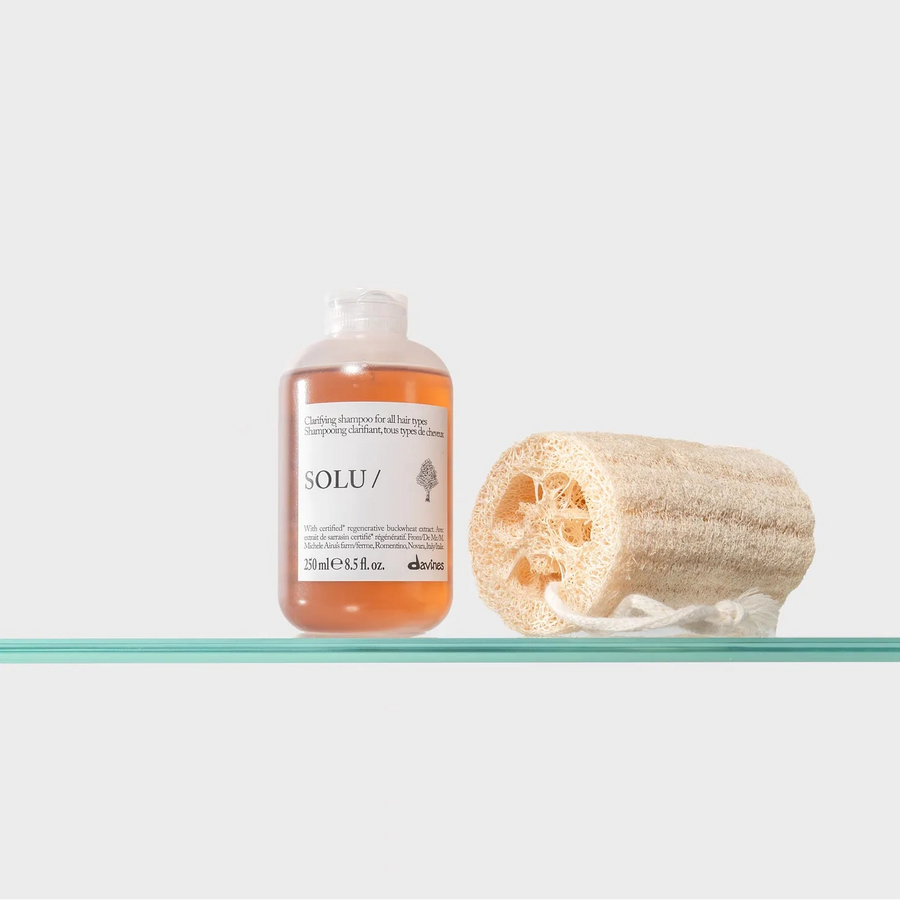 Moda Salon Davines SOLU shampoo with loofah on shelf