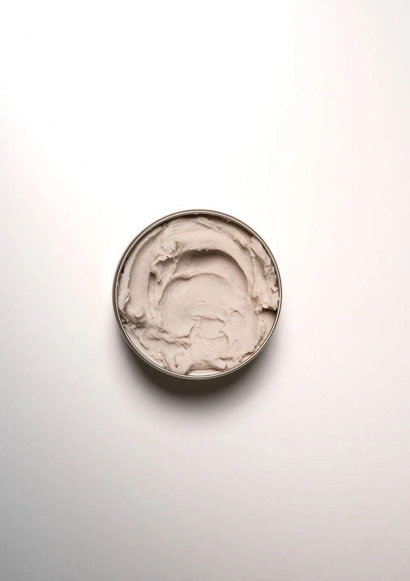 Professional scalp treatment texture in an open jar