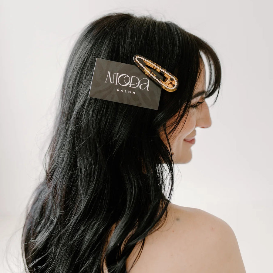 Moda Salon hair clip on dark hair