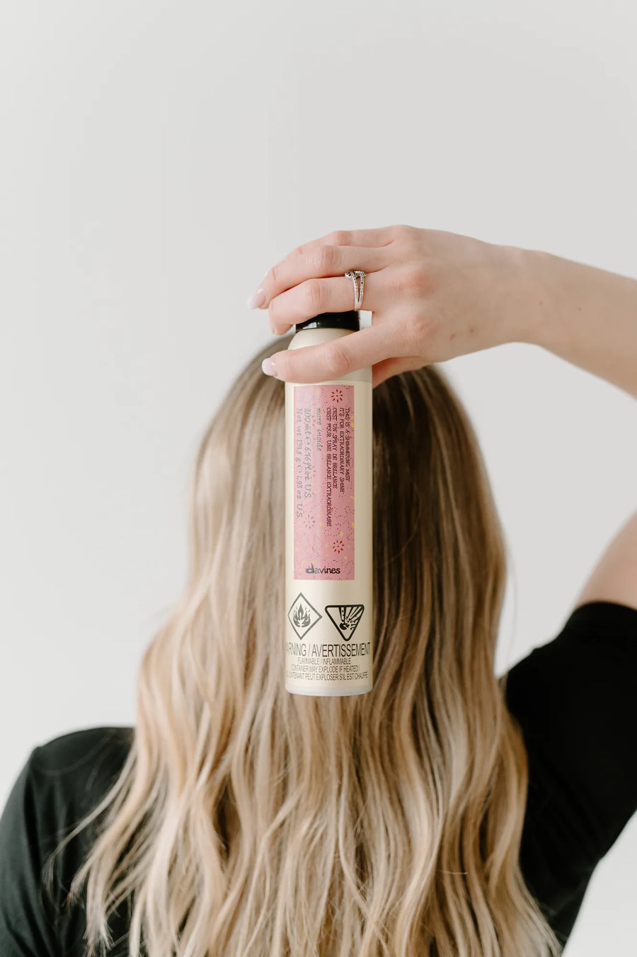 Moda Salon product held on blonde hair, creative